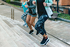 Young women friends training running up stairs in town, a Sports & Recreation Photo by davidpereiras