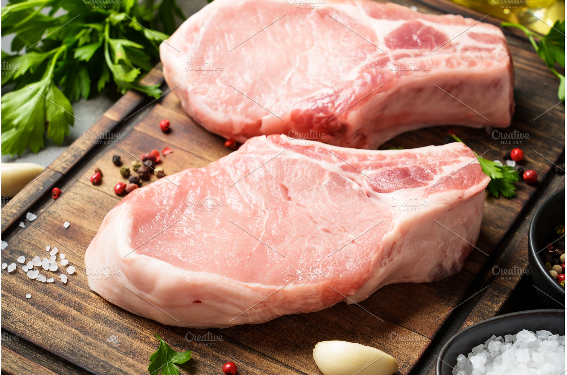 Raw pork meat on cutting board with, a Food & Drink Photo by Nadia-nb