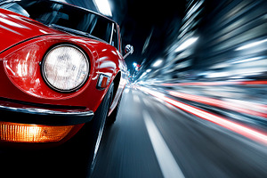 Classic red sports car speeding, a Transportation Photo by MistyDay