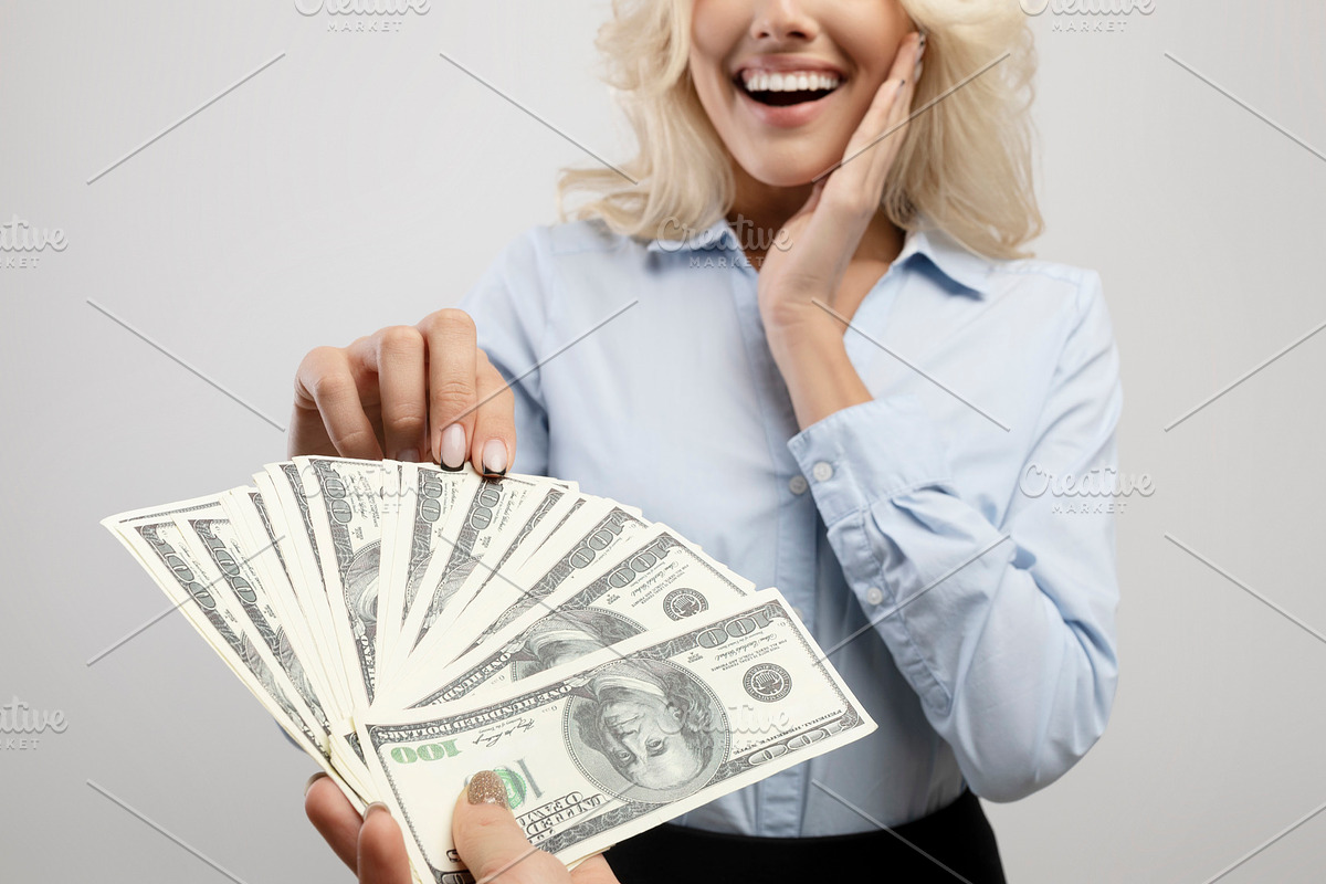 Corruption concept. Female hand giving money to surprised businesswoman on ligh, a Photo by Prostock-Studio (Photo 3 of 3)