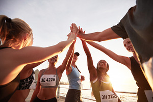Group of athletes high fiving, a Sports & Recreation Photo by Jacob Lund