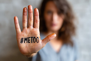 Woman showing #metoo message on palm, a Person Photo by AlyaAnd