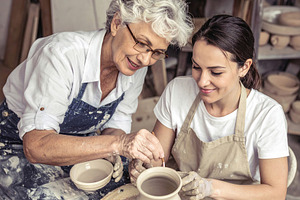 Grandmother Guiding Young Woman in Pottery, an Arts & Entertainment Photo by Davizro's Market