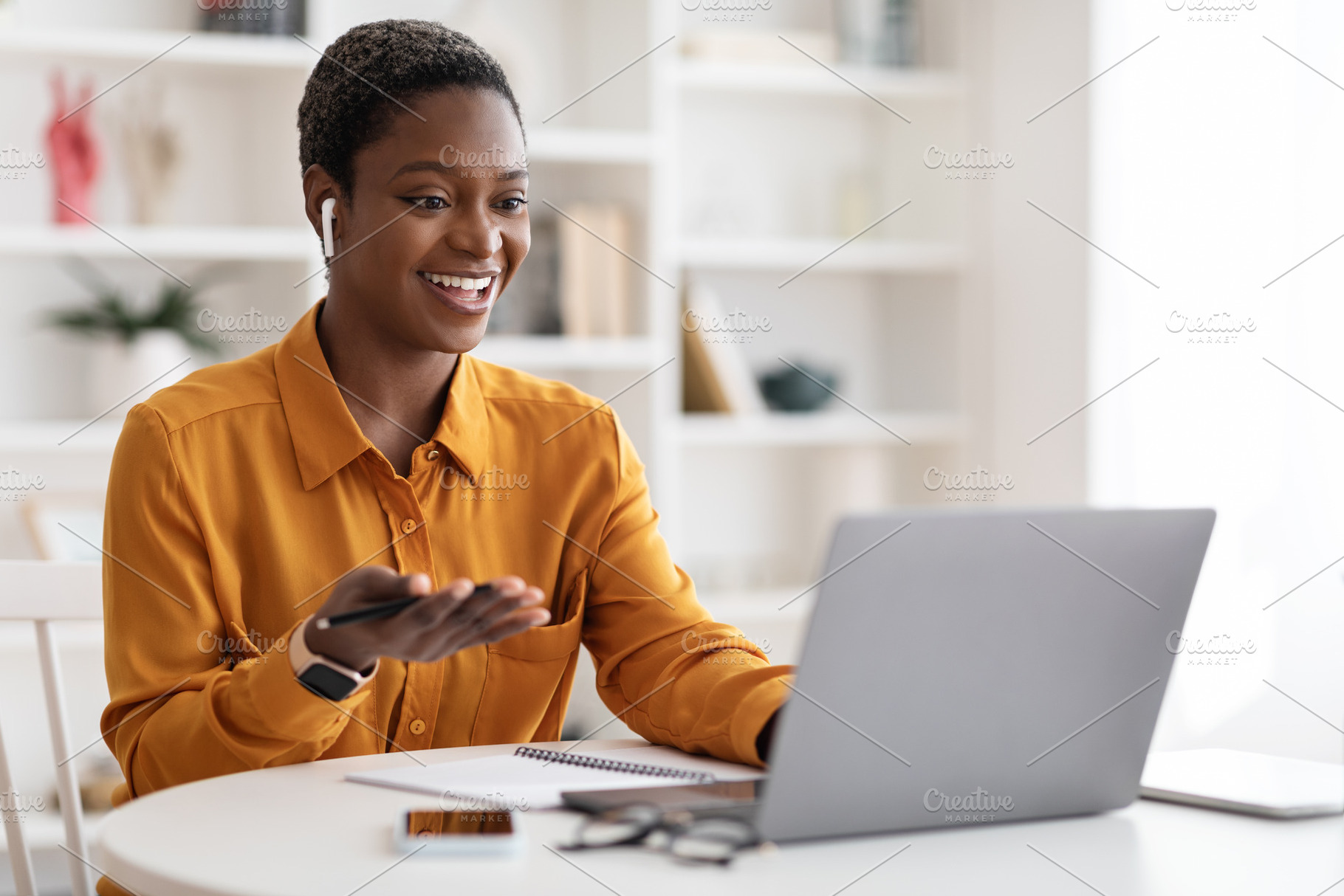 Young black woman having video conference with clients, copy space, a Photo by Prostock-Studio