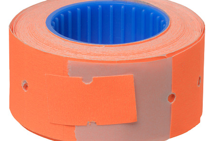 A roll of orange self-adhesive price tags or perforated labels w