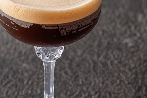 Classic Espresso Martini with thick crema foam and coffee bean g
