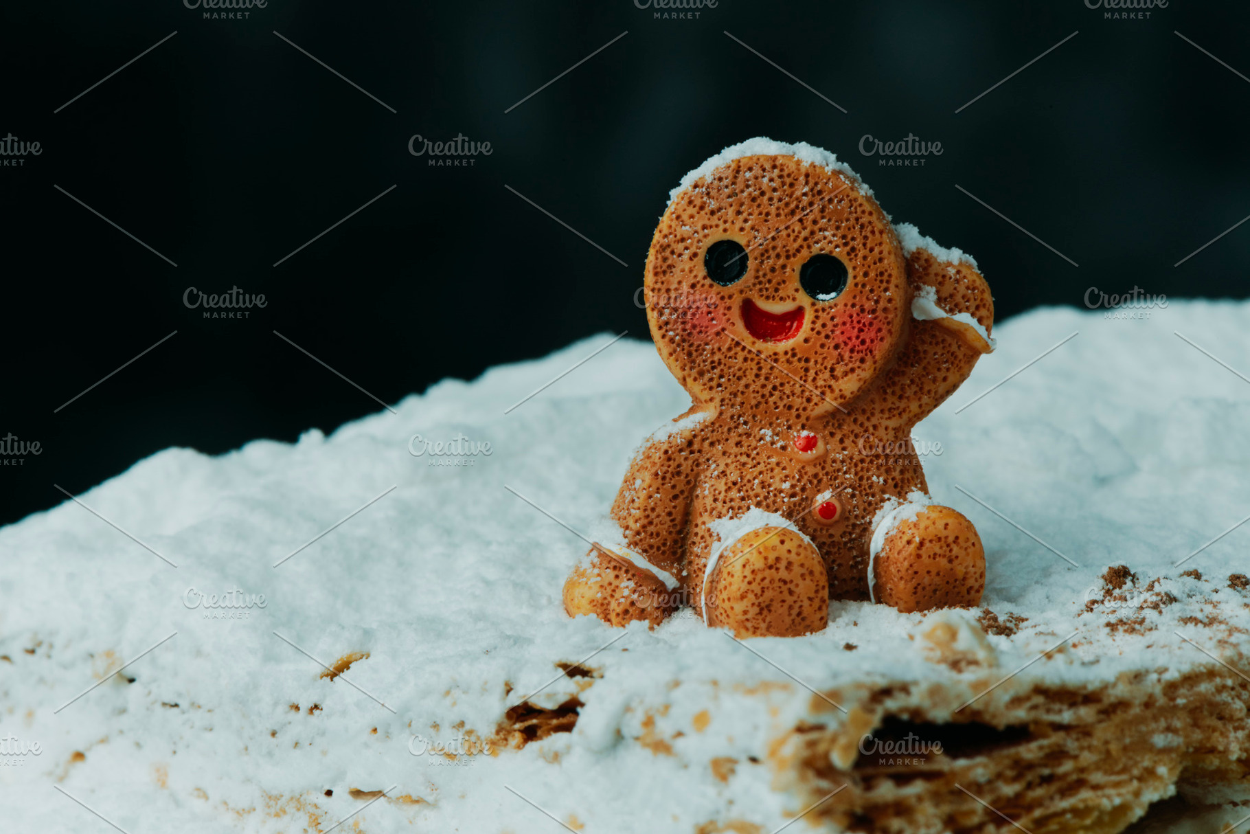 gingerbread man sitting on meringue milhojas, a Photo by Nito