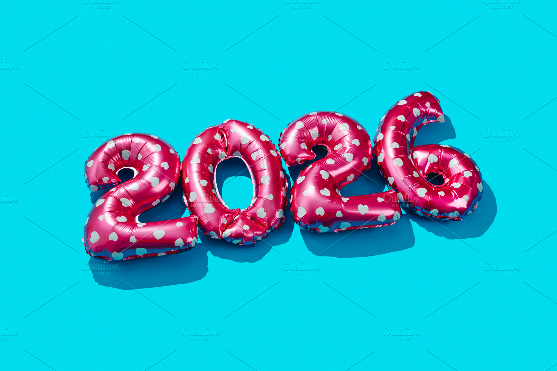 pink balloons form number 2026 as the new year, a Photo by Nito