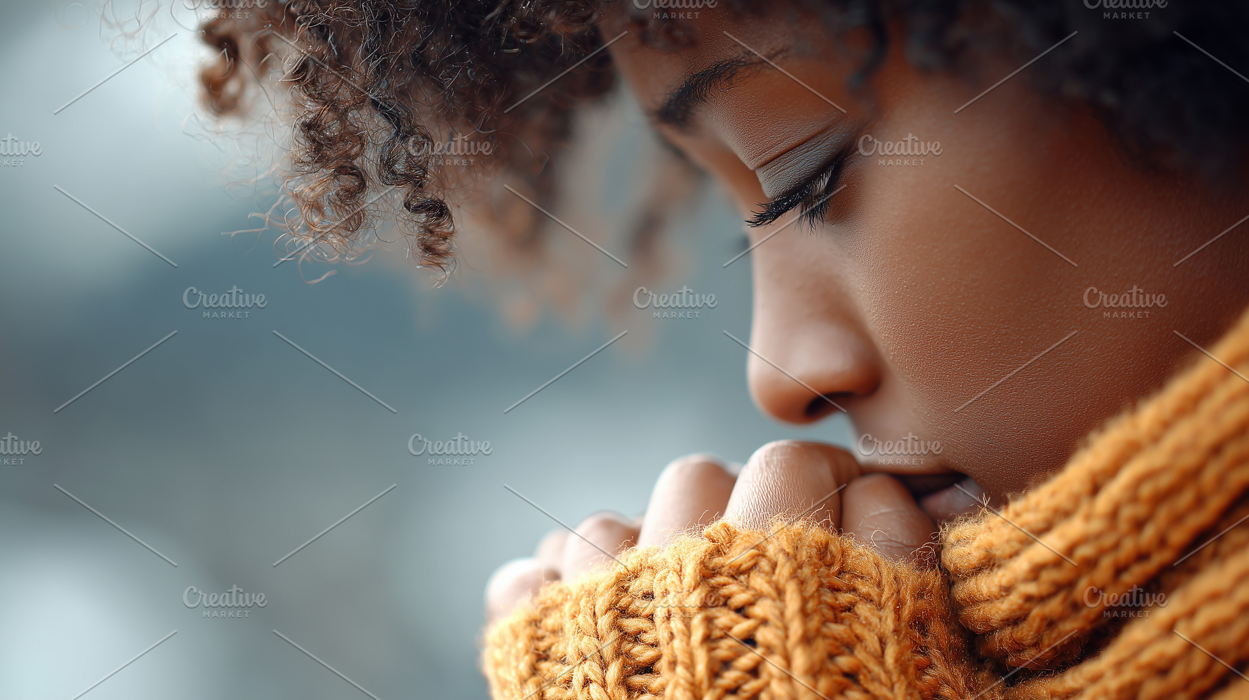 Young black woman in a cozy orange s, a Health & Medical Photo by MistyDay