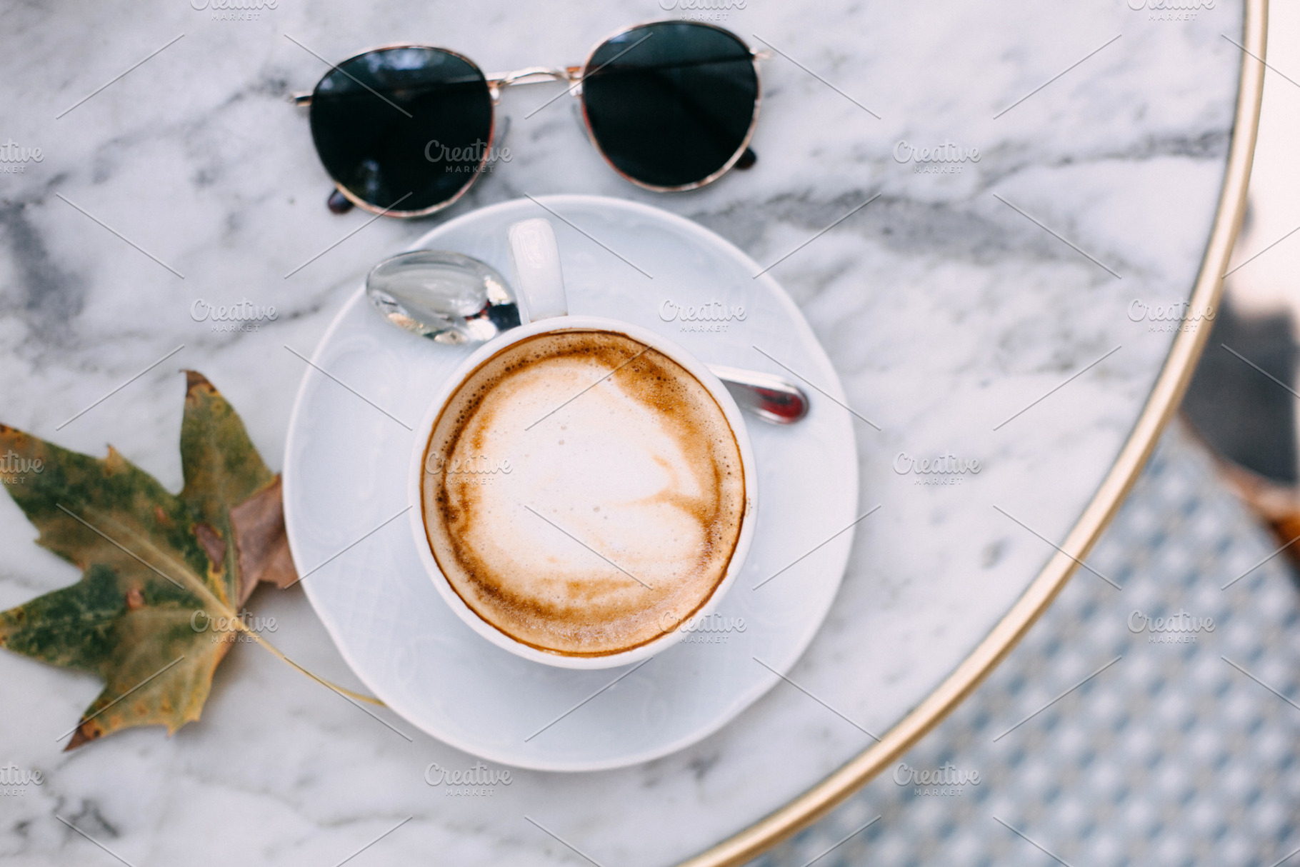 Cappuccino on a marble table, a Food & Drink Photo by Fargana
