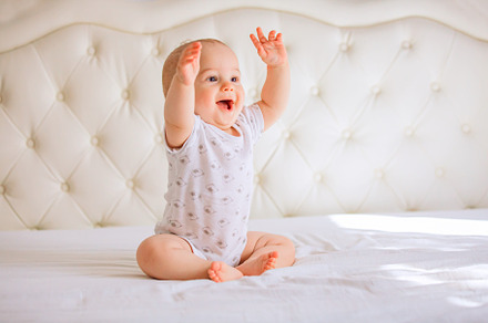 Cute baby boy in white sunny bedroom, a Person Photo by Rodica Ciorba