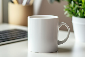 Plain white ceramic mug on a modern, a Food & Drink Photo by MistyDay