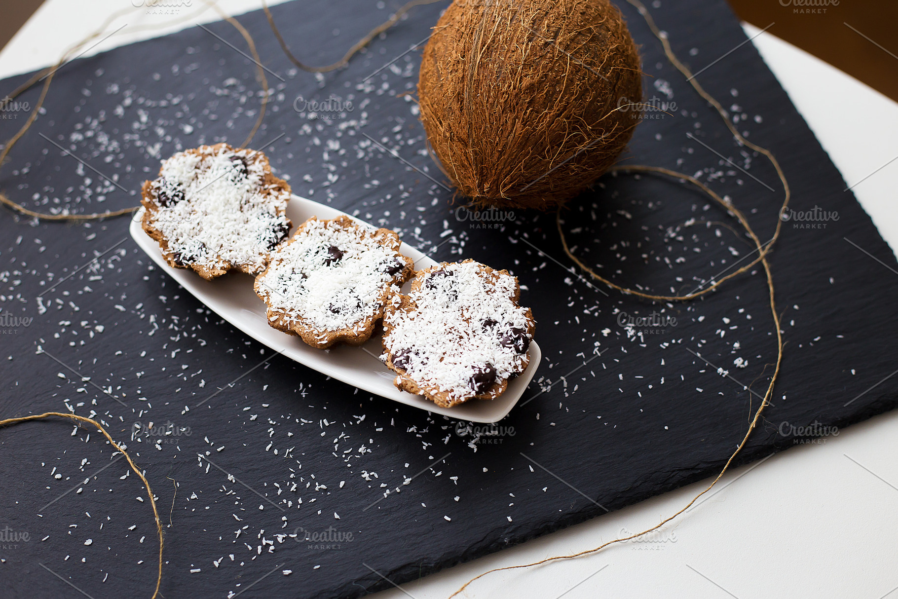 coconut muffins on a black background, a Food & Drink Photo by Artsaba Family