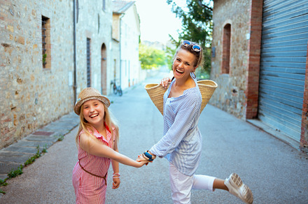mother and child tourists in Tuscany, Italy enjoying promenade, a Person Photo by Alliance Images