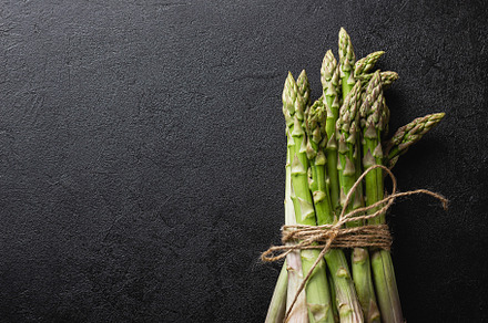 Green asparagus on a black table
