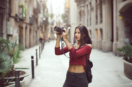 Beautiful tourist woman taking a containing camera, woman, and outdoors, a Person Photo by Emotion photo