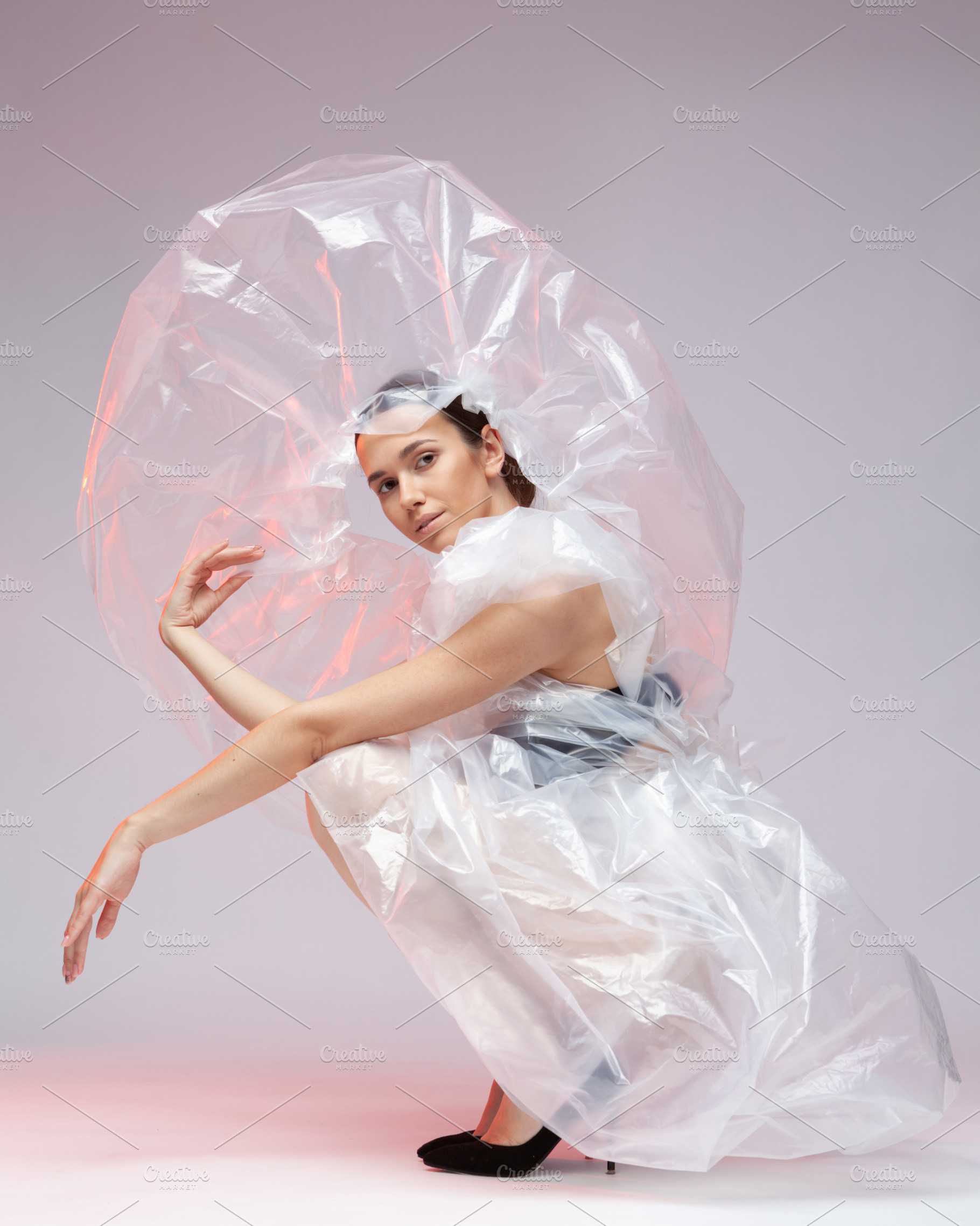 Girl posing in a dress made of featuring vogue, fashion, and plastic, a Beauty & Fashion Photo by sport&beauty stock photo