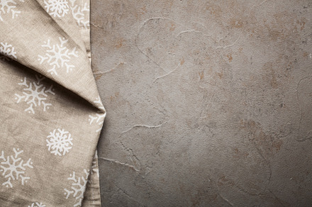 Kitchen stone table with towel top view with copy space concrete beige, an Abstract Photo by Budarinphoto