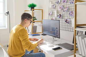 Man Analyzing Finances at Home