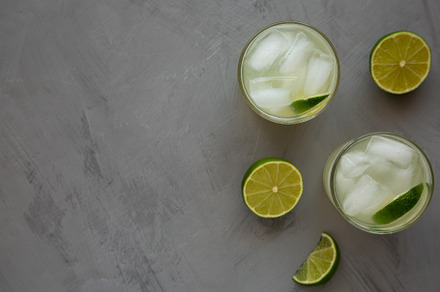 Homemade Cold Refreshing Iced Limeade in a Glass, top view. Flat, a Food & Drink Photo by LiudmylaChuhunova