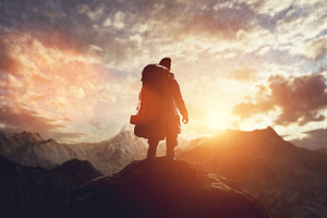 Man on the peak of mountain.