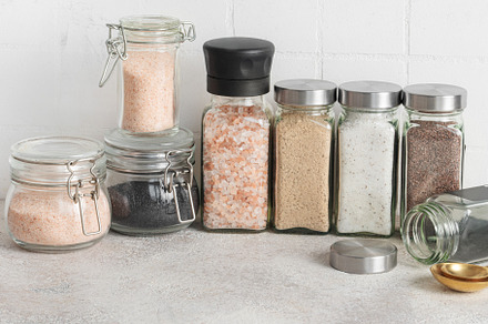 Jars with assorted speciality salt, a Food & Drink Photo by Olena Rudo