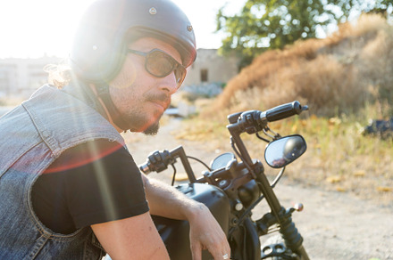 Young man wearing sunglasses on a chopper motorcycle, a Person Photo by 2Design