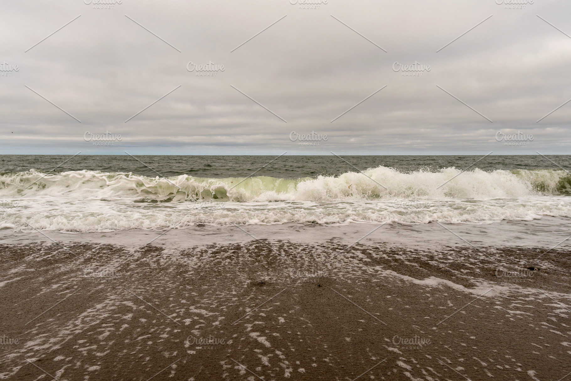 Powerful ocean wave crashing on sand, a Nature Photo by Elena Vagengeim