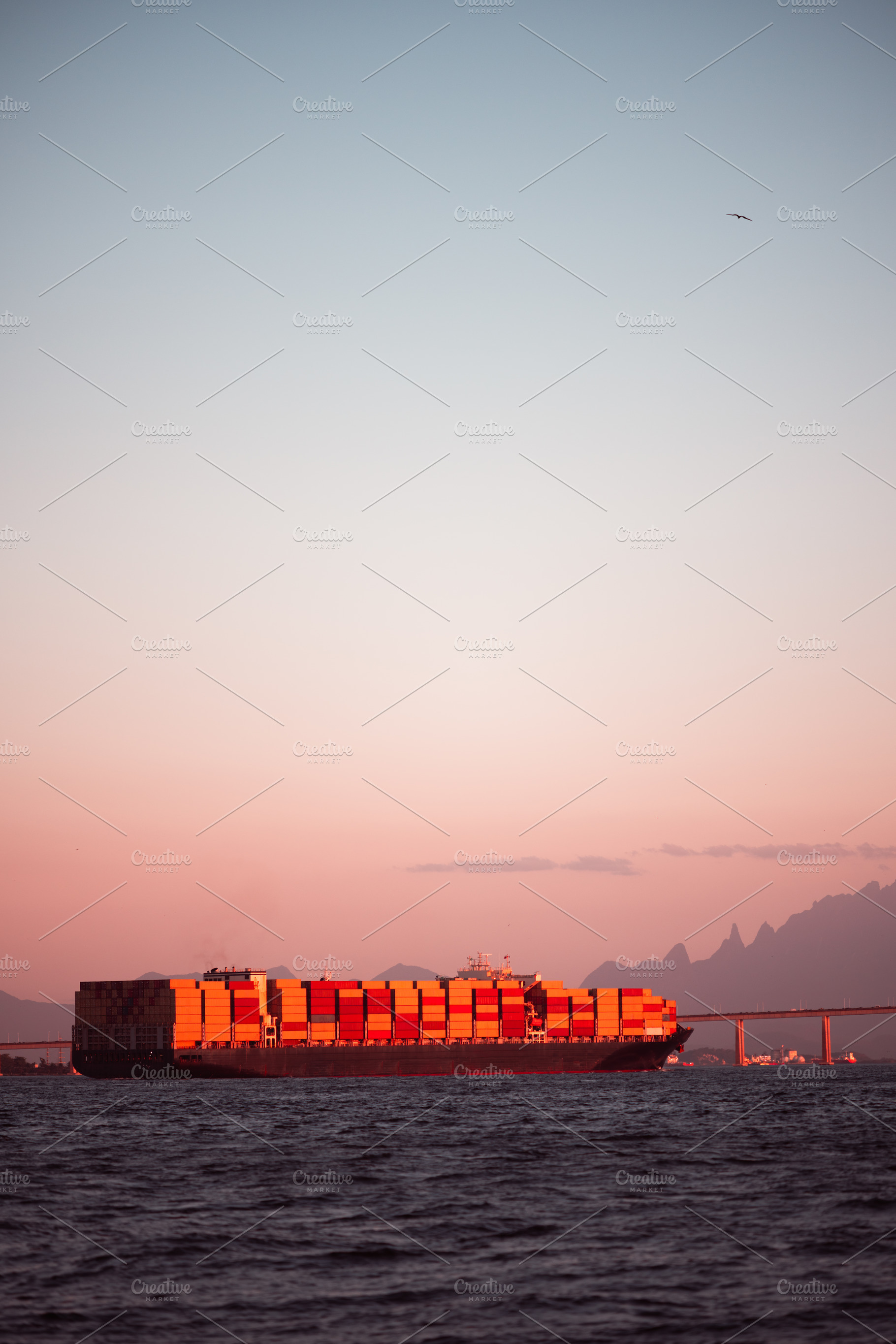 Sunset container ship seascape, a Transportation Photo by SkyNext