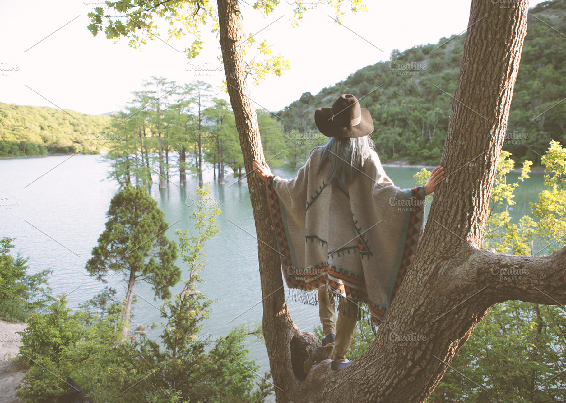 Young woman in poncho featuring boho, fashion, and women, a Person Photo by Anton_Sokolov