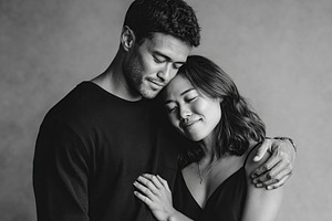 Couple embraces tenderly in a cozy, intimate studio setting, a Person Photo by AlyaAnd