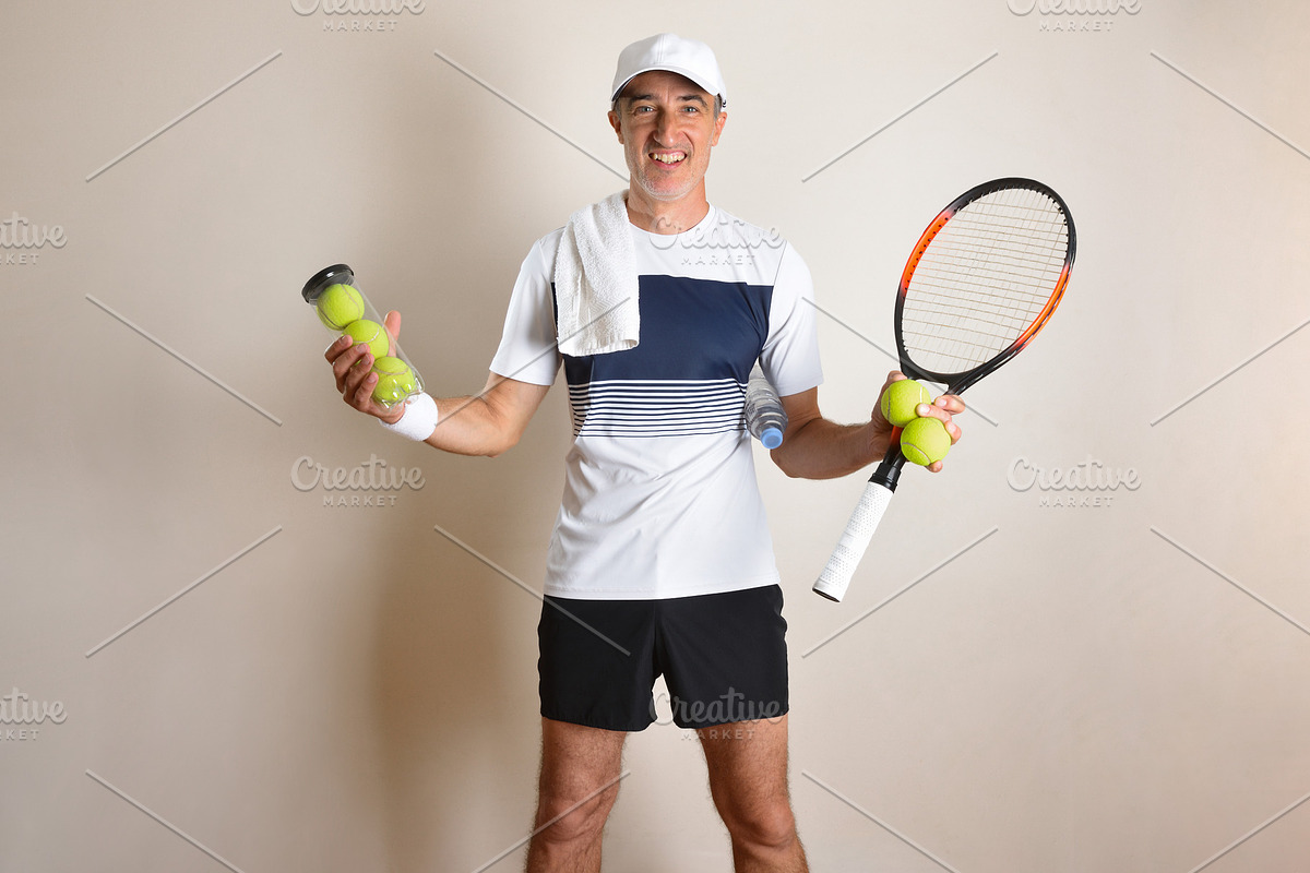 Smiling Tennis Player with Racket and Balls, a Sports & Recreation Photo by Davizro's Market (Photo 2 of 2)