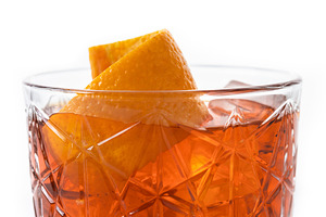 Americano cocktail garnished with twist orange isolated on white background, a Food & Drink Photo by etorres69