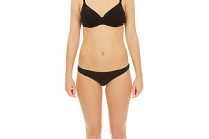 Happy woman standing in bikini.