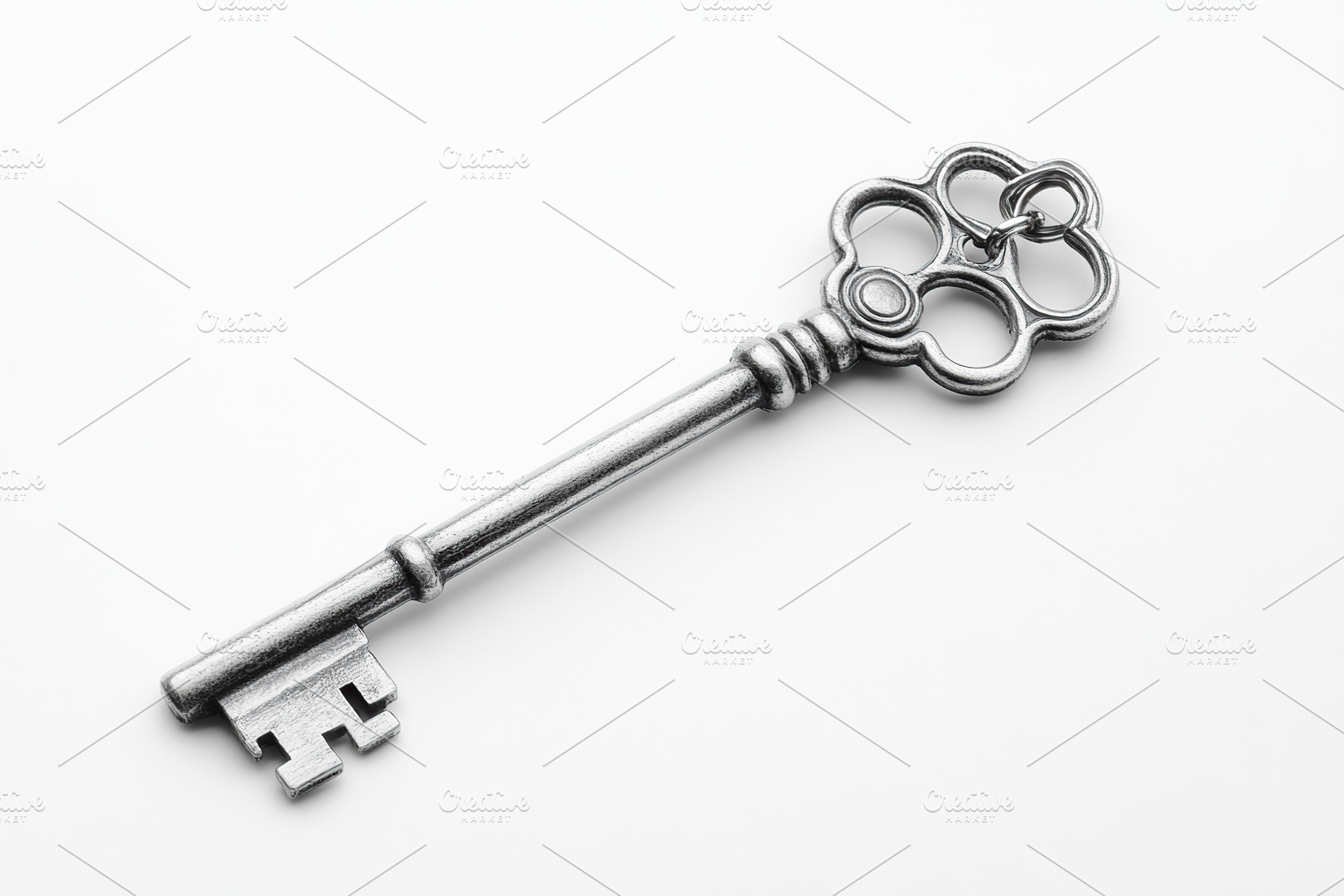 Unique vintage key on a plain background showcasing intricate de, a Photo by AlyaAnd