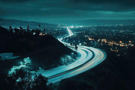 Nighttime traffic flows on a winding, a Photo by Iftikhar Alam