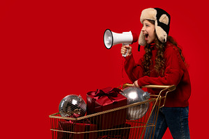 Girl in red sweater and fur hat, a Holiday Photo by Elena Vagengeim