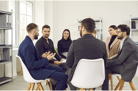 Group of company employees meeting, a Person Photo by StudioRomantic