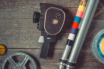 Old movie camera and tripod, an Arts & Entertainment Photo by SergeKa