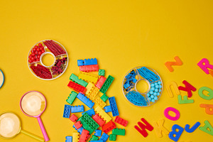 Vibrant collection of colorful school supplies, building bricks,, an Abstract Photo by ndanko