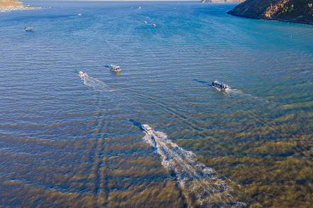 Top view of a boat sailing to the containing boat, sea, and blue, a Nature Photo by Elizaveta Galitskaya
