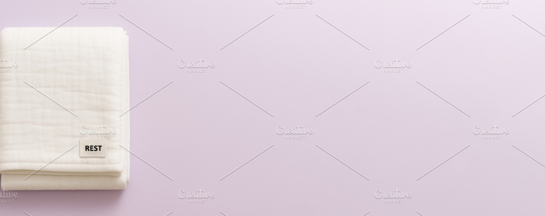 White folded blanket on pastel backg, a Photo by Dvoevnore photos