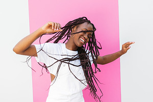 Happy girl in white overall dancing, a Person Photo by Artem Varnitsin