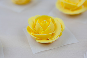 Yellow icing roses featuring baking, bloom, and blossom