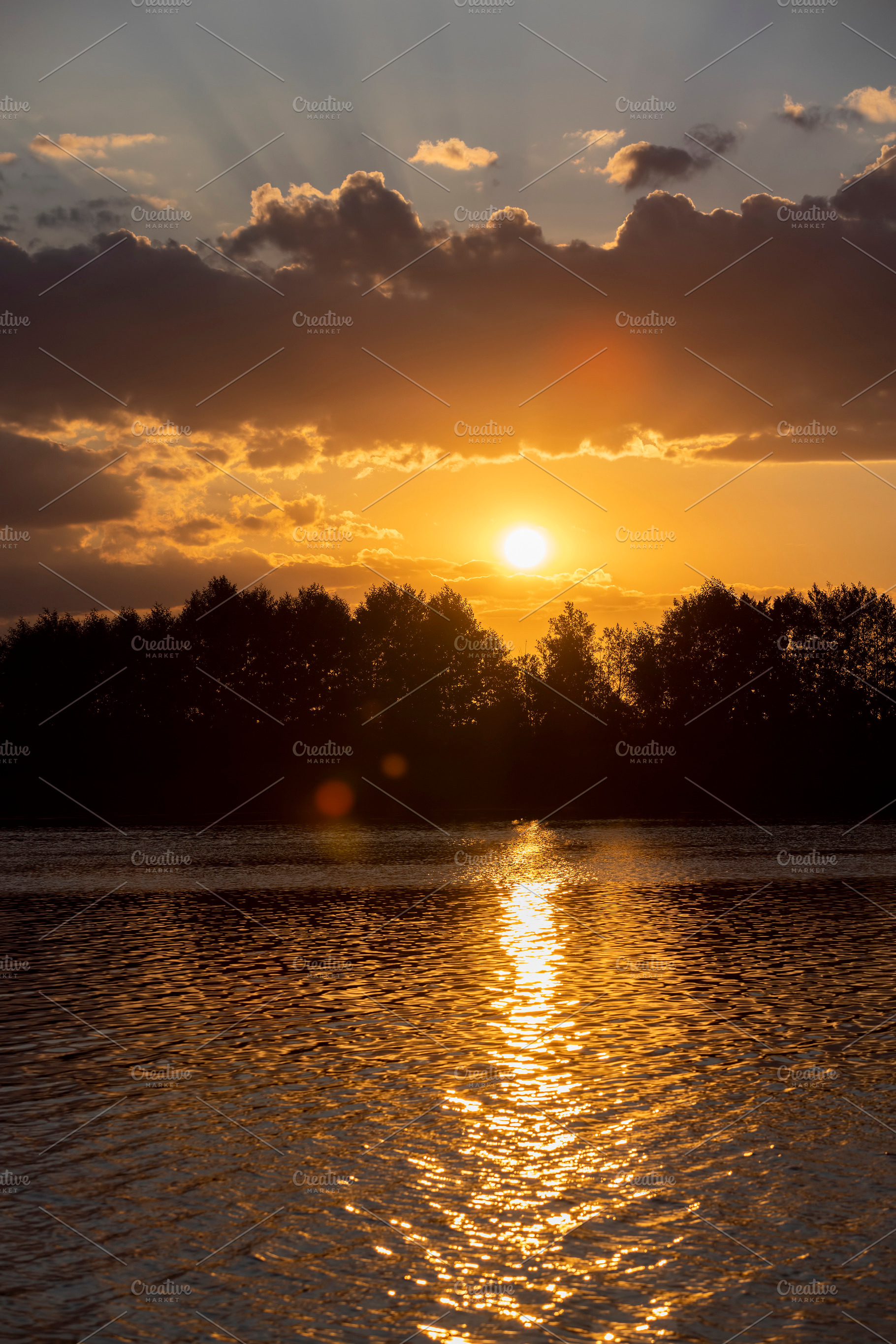the lake with orange water in the summer at sunset, a Photo by rsoollAI