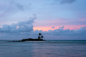 Sunset over a tropical motu on Tikehau Atoll, French Polynesia, a Nature Photo by GoodGoods