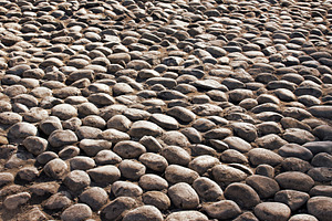 Old grunge grey cobble stone, a Photo by saiko3p
