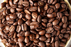 Organic Roasted Coffee Beans in a Bowl, top view., a Food & Drink Photo by LiudmylaChuhunova
