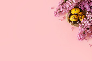 Easter flat lay. Stylish easter eggs in nest and lilac flowers o, a Holiday Photo by Sonjachni