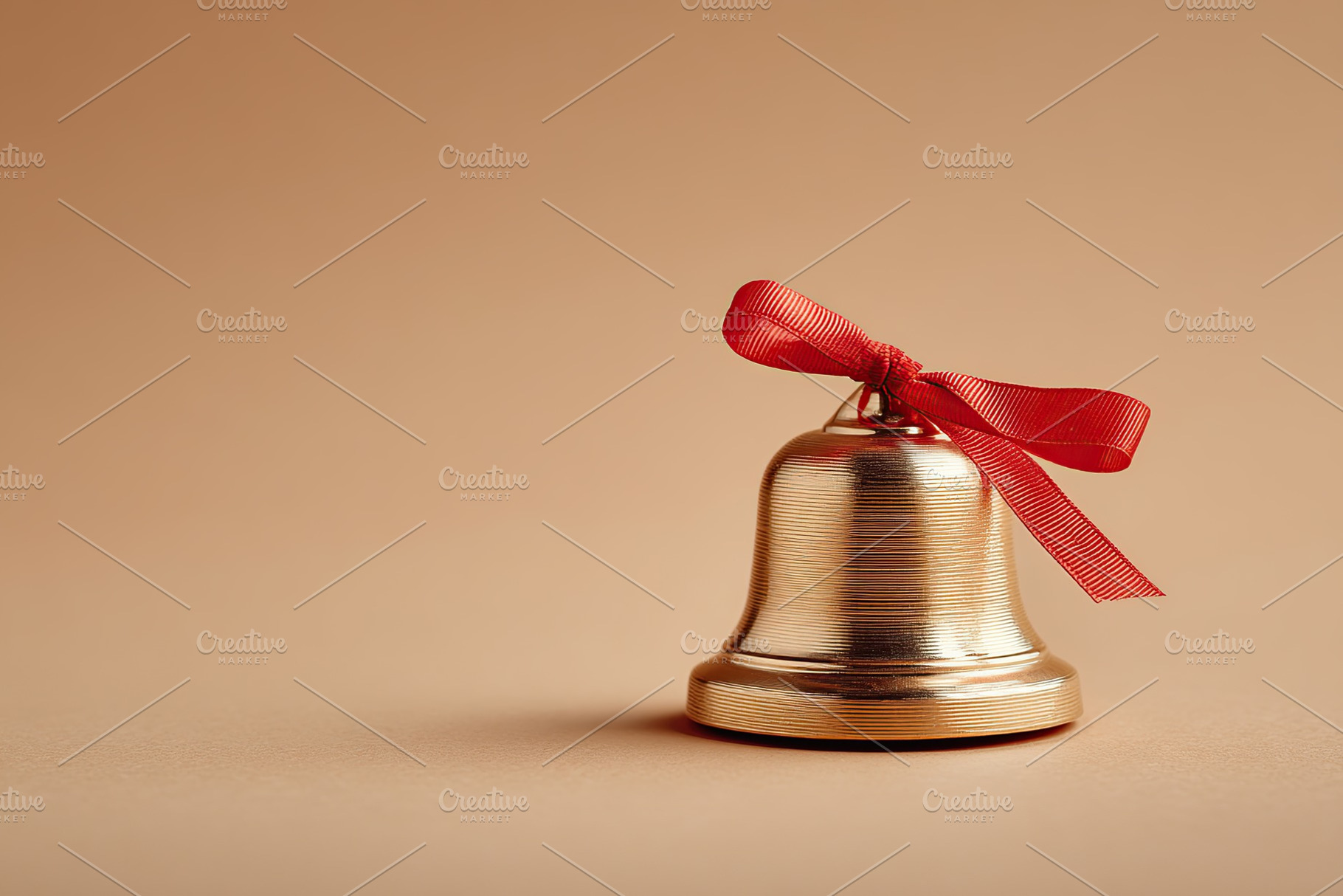 Decorative bell with red ribbon on a neutral background for celebration or holi, a Photo by AlyaAnd